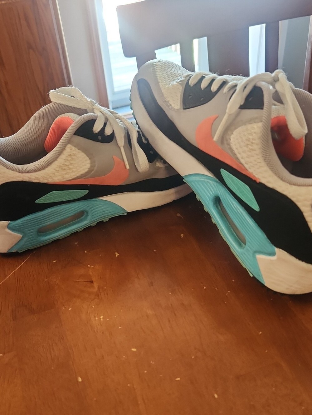 Nike Kids White Sneakers with Coral Swoosh and Teal Accents